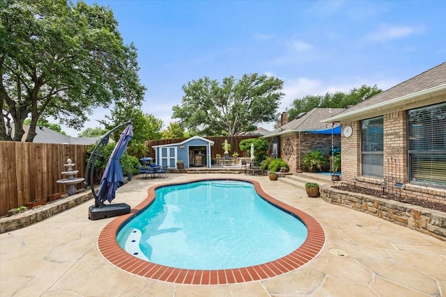 10013 Stoneleigh Dr, Benbrook, TX 76126 - view of swimming pool with a patio, a fenced backyard, and an outbuilding