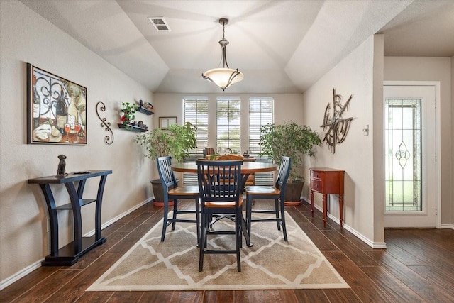 10013 Stoneleigh Dr, Benbrook, TX 76126 - dining area featuring dark wood finished floors, plenty of natural light, baseboards, and vaulted ceiling