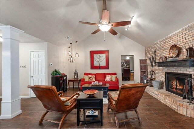 10013 Stoneleigh Dr, Benbrook, TX 76126 - living room featuring a ceiling fan, decorative columns, lofted ceiling, a fireplace, and baseboards