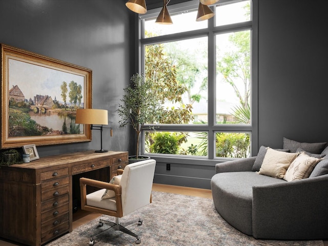 home office with wood finished floors