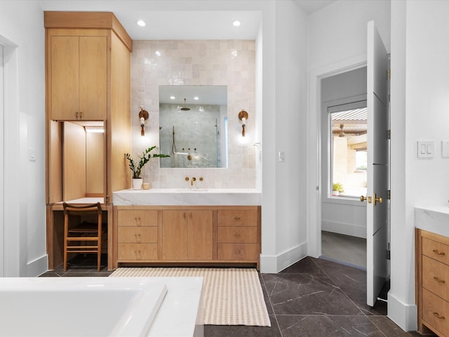 bathroom with marble finish flooring, vanity, baseboards, a walk in shower, and recessed lighting
