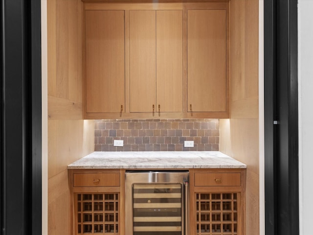 bar with wine cooler and decorative backsplash