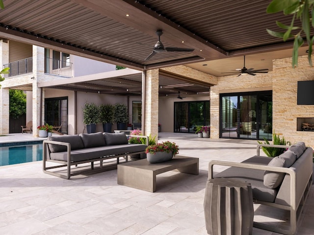 view of patio with a ceiling fan, outdoor lounge area, and an outdoor pool