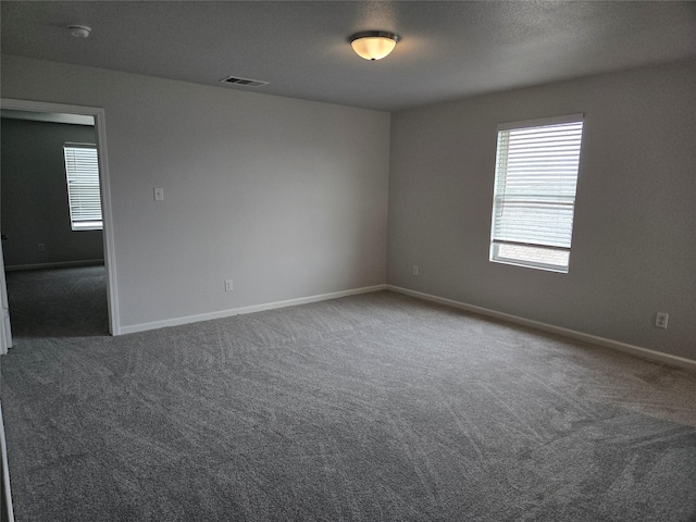 6310 Tropicana Ln, Forney, TX 75126 - spare room featuring carpet flooring, baseboards, and a smoke detector