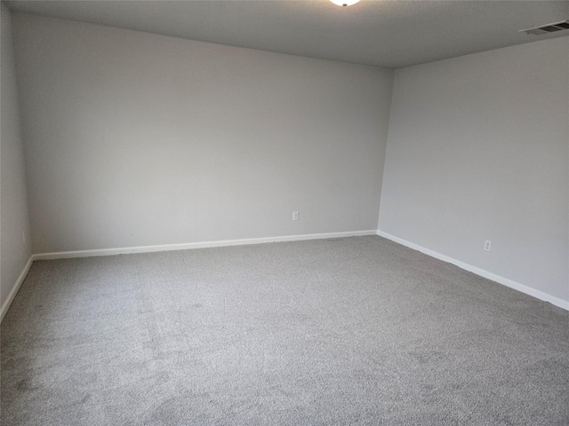 6310 Tropicana Ln, Forney, TX 75126 - spare room featuring baseboards and dark colored carpet