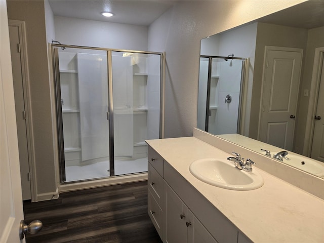 6310 Tropicana Ln, Forney, TX 75126 - full bathroom featuring a stall shower, wood finished floors, and vanity