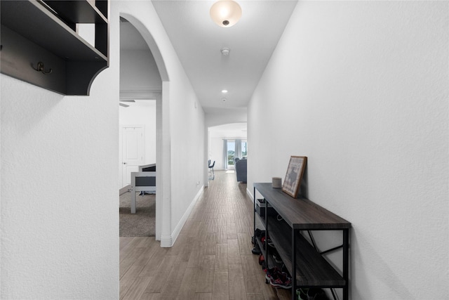 3008 Aransas Ave, Aubrey, TX 76227 - corridor featuring arched walkways, wood finished floors, baseboards, and recessed lighting