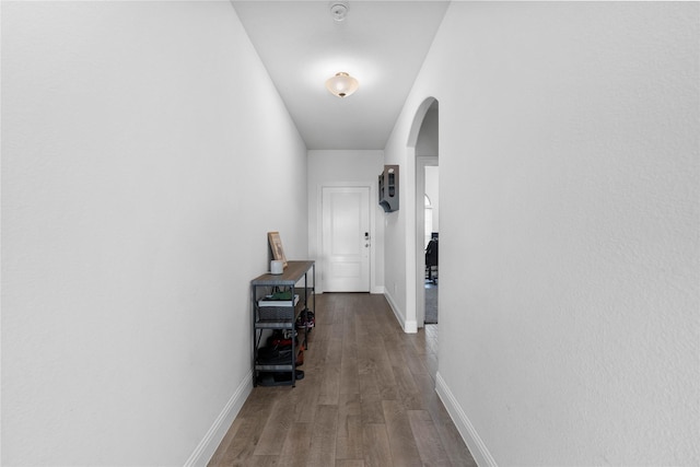 3008 Aransas Ave, Aubrey, TX 76227 - hallway featuring wood finished floors, arched walkways, and baseboards