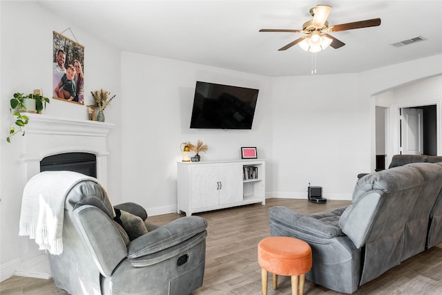 3008 Aransas Ave, Aubrey, TX 76227 - living area with a ceiling fan, light wood-type flooring, and baseboards