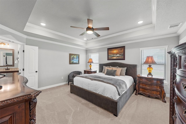 bedroom with a raised ceiling, light carpet, baseboards, crown molding, and ceiling fan