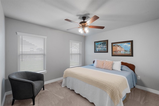 bedroom with carpet flooring, baseboards, and ceiling fan