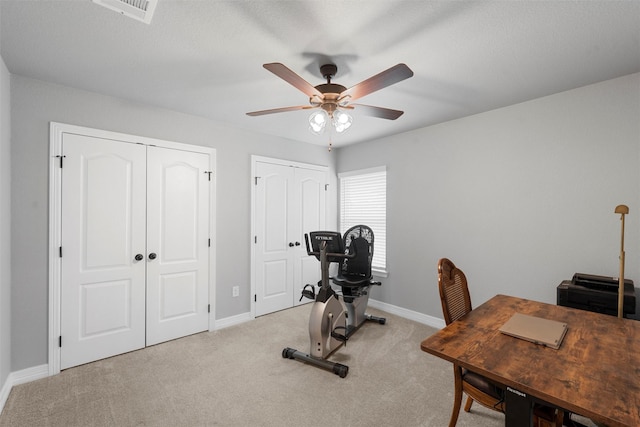 office with a ceiling fan, baseboards, and carpet