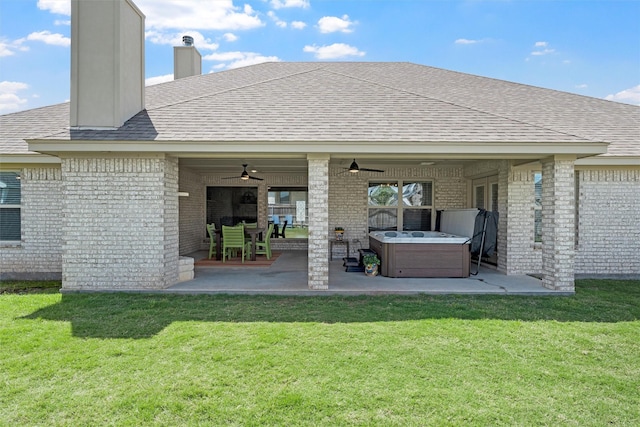 back of house with a ceiling fan, brick siding, a chimney, and a patio