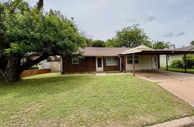2142 Woodard St, Abilene, TX 79605 - ranch-style home with an attached carport and concrete driveway