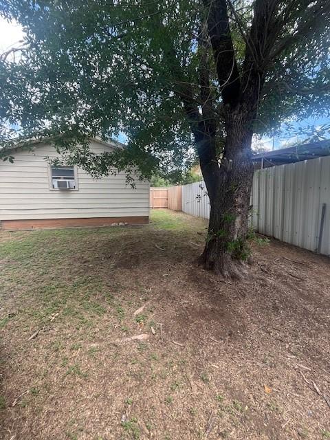 2142 Woodard St, Abilene, TX 79605 - fenced backyard with cooling unit