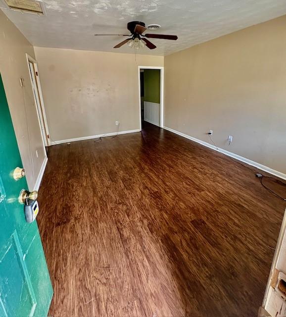 2142 Woodard St, Abilene, TX 79605 - unfurnished room featuring wood finished floors, ceiling fan, and baseboards
