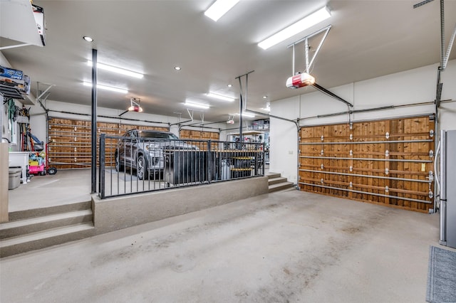 6645 Whispering Woods Ct, Plano, TX 75024 - garage featuring a garage door opener