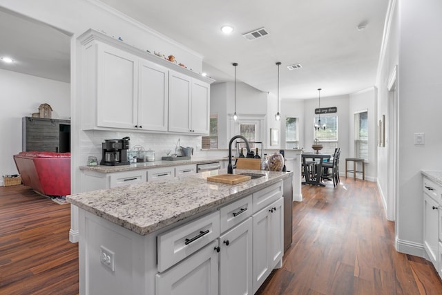 kitchen featuring a sink, white cabinets, dark wood-style floors, decorative backsplash, and recessed lighting