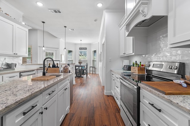 kitchen with appliances with stainless steel finishes, custom range hood, white cabinetry, dark wood-style floors, and recessed lighting