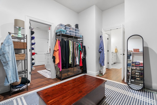 walk in closet featuring wood finished floors