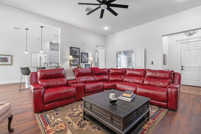 living area featuring a ceiling fan, dark wood-style flooring, recessed lighting, and baseboards