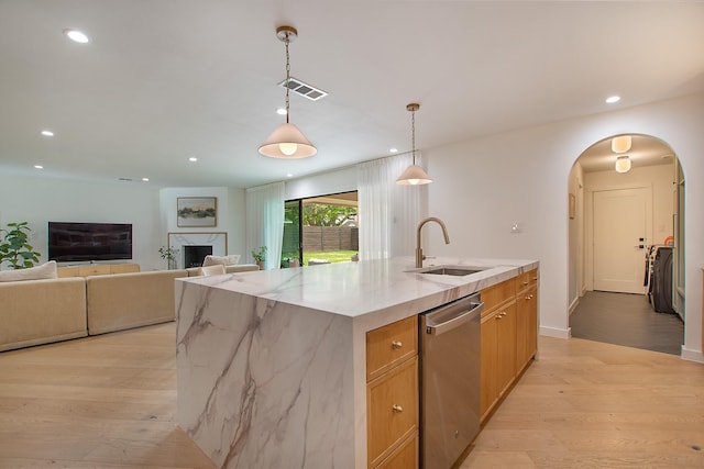 3314 Norcross Ln, Dallas, TX 75229 - kitchen featuring dishwasher, a sink, light wood finished floors, an island with sink, and arched walkways