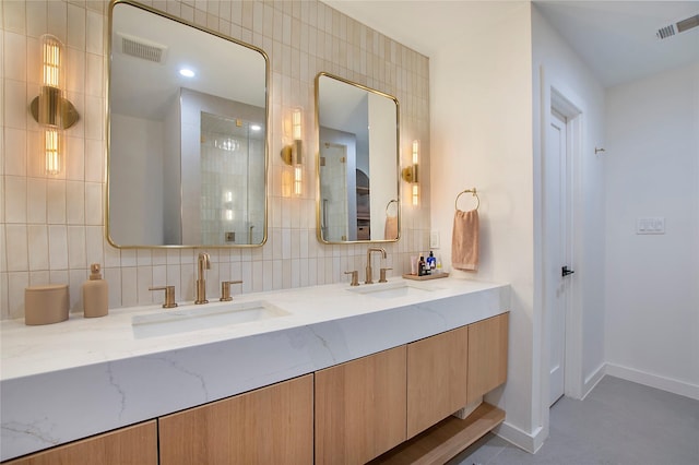 3314 Norcross Ln, Dallas, TX 75229 - bathroom featuring tasteful backsplash, baseboards, and double vanity