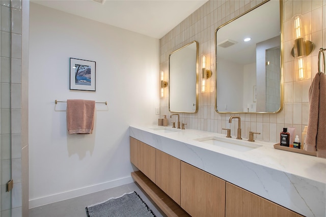 3314 Norcross Ln, Dallas, TX 75229 - bathroom featuring baseboards, double vanity, and backsplash