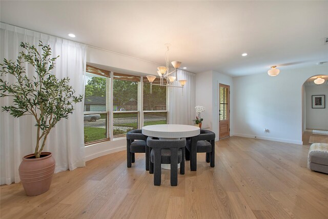 3314 Norcross Ln, Dallas, TX 75229 - dining area featuring arched walkways, a chandelier, light wood-style floors, baseboards, and recessed lighting