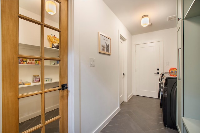 3314 Norcross Ln, Dallas, TX 75229 - corridor featuring washing machine and clothes dryer and baseboards