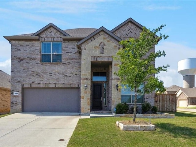 1044 Pitch Pine St, Hickory Creek, TX 75065 - view of front facade featuring a garage, concrete driveway, brick siding, and stone siding