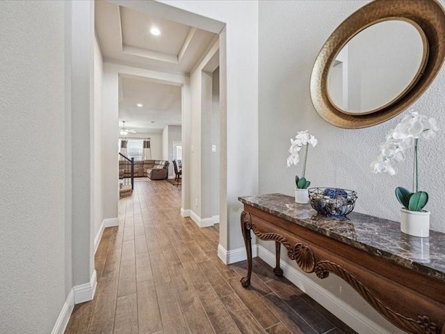1044 Pitch Pine St, Hickory Creek, TX 75065 - corridor with dark wood-style floors, a raised ceiling, and baseboards