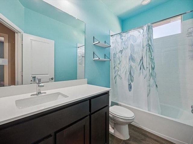 1044 Pitch Pine St, Hickory Creek, TX 75065 - bathroom featuring wood finished floors, shower / bathtub combination with curtain, toilet, and vanity