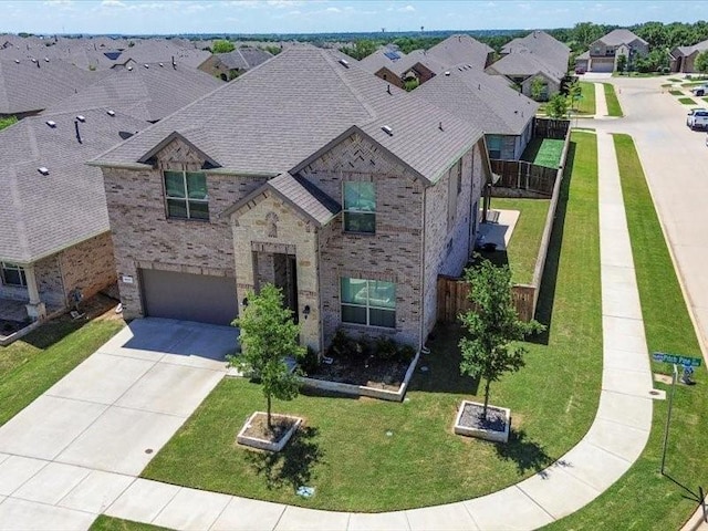 1044 Pitch Pine St, Hickory Creek, TX 75065 - view of front of home with brick siding, driveway, a garage, a residential view, and roof with shingles