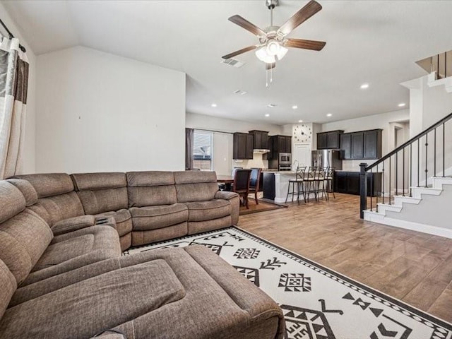 1044 Pitch Pine St, Hickory Creek, TX 75065 - living room featuring light wood-style flooring, ceiling fan, stairs, recessed lighting, and baseboards