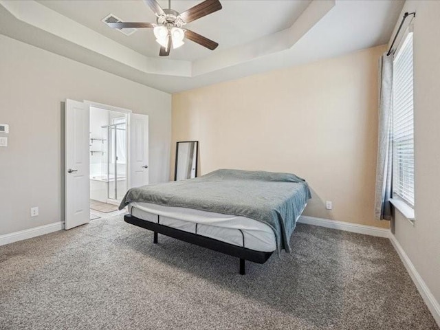 1044 Pitch Pine St, Hickory Creek, TX 75065 - bedroom featuring a tray ceiling, carpet floors, baseboards, and ceiling fan