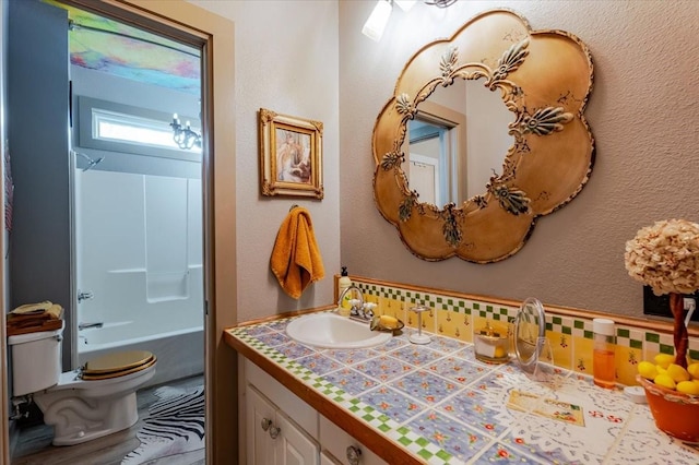 109 Mariah Dr, Weatherford, TX 76087 - full bath with vanity, toilet, tasteful backsplash, and shower / washtub combination