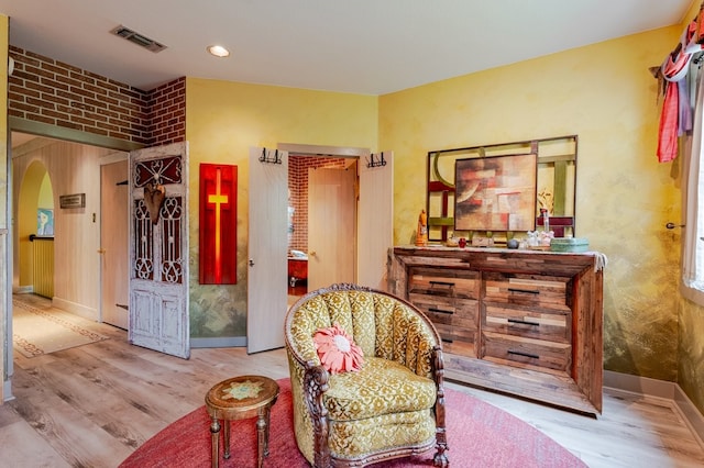 109 Mariah Dr, Weatherford, TX 76087 - sitting room featuring wood finished floors, arched walkways, and baseboards