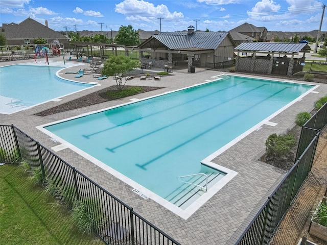 6213 Bracken Dr, Celina, TX 76227 - community pool with fence, a patio, and a residential view