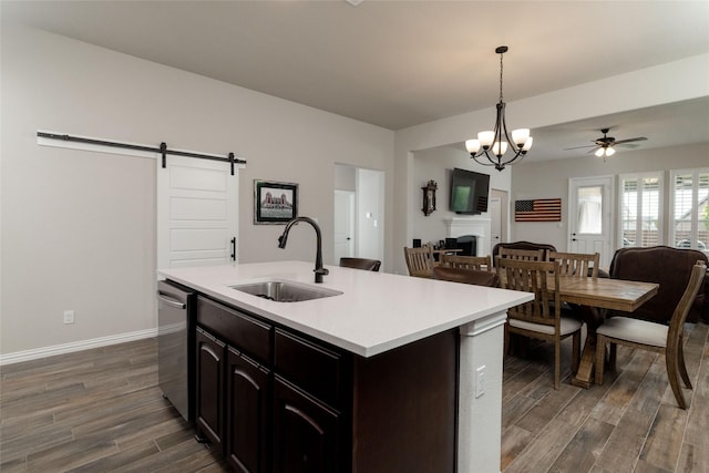 1705 Surrey Ct, Weatherford, TX 76087 - kitchen with a sink, open floor plan, dark wood-style floors, and light countertops