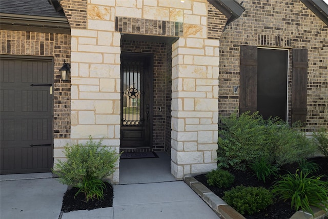 1705 Surrey Ct, Weatherford, TX 76087 - view of exterior entry with brick siding and stone siding