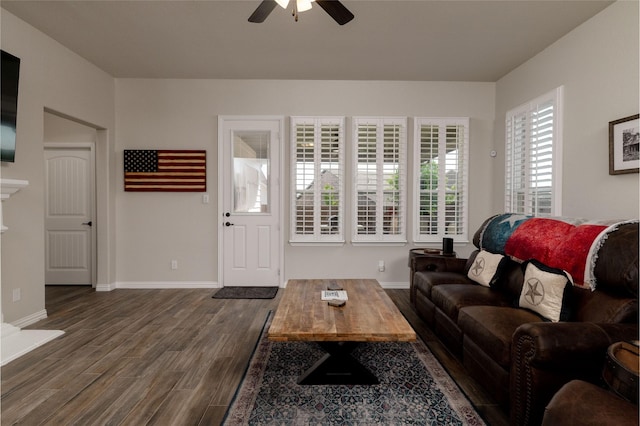 1705 Surrey Ct, Weatherford, TX 76087 - living area featuring a ceiling fan, dark wood-style floors, and baseboards