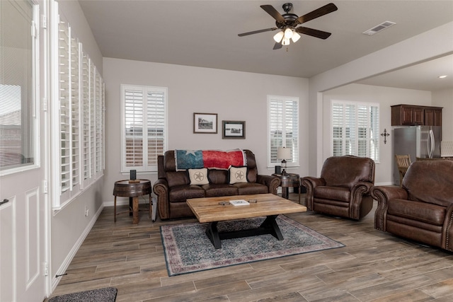 1705 Surrey Ct, Weatherford, TX 76087 - living room with ceiling fan, wood finished floors, and baseboards