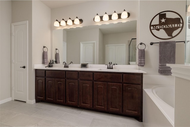 1705 Surrey Ct, Weatherford, TX 76087 - full bath with a garden tub, double vanity, and baseboards
