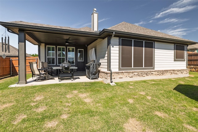 1705 Surrey Ct, Weatherford, TX 76087 - rear view of property with ceiling fan, brick siding, a chimney, a patio area, and roof with shingles