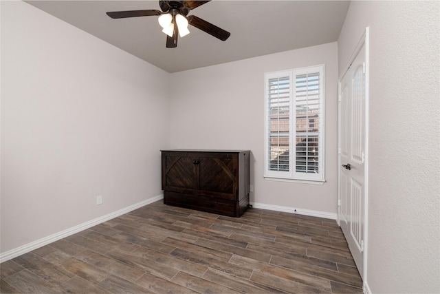 1705 Surrey Ct, Weatherford, TX 76087 - empty room featuring a ceiling fan, wood finished floors, and baseboards