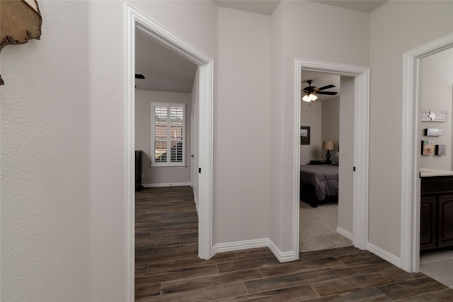 1705 Surrey Ct, Weatherford, TX 76087 - hallway featuring wood tiled floors and baseboards