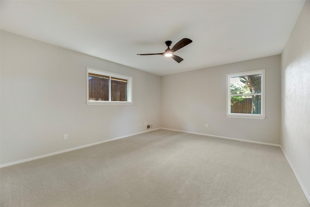 7324 Heathermore Dr, Dallas, TX 75248 - spare room featuring light carpet, a ceiling fan, and baseboards