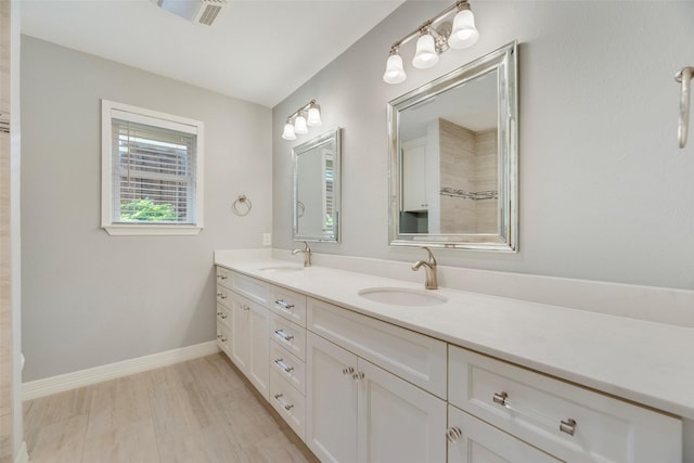7324 Heathermore Dr, Dallas, TX 75248 - full bath featuring double vanity and baseboards