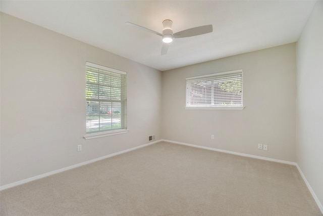 7324 Heathermore Dr, Dallas, TX 75248 - spare room featuring light carpet, a ceiling fan, and baseboards